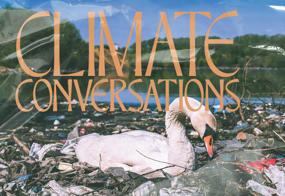 Climate Conversations: Swan floating in lake surrounded by garbage